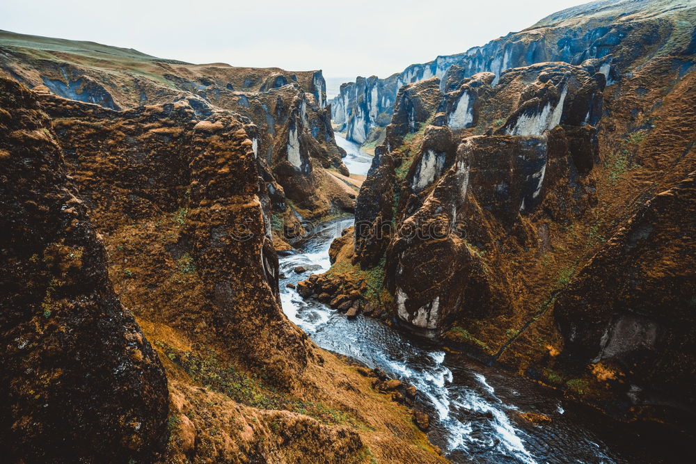 Similar – River flowing in mountains