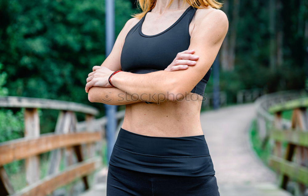 Similar – Woman stretching her body in front of ancient wall in park