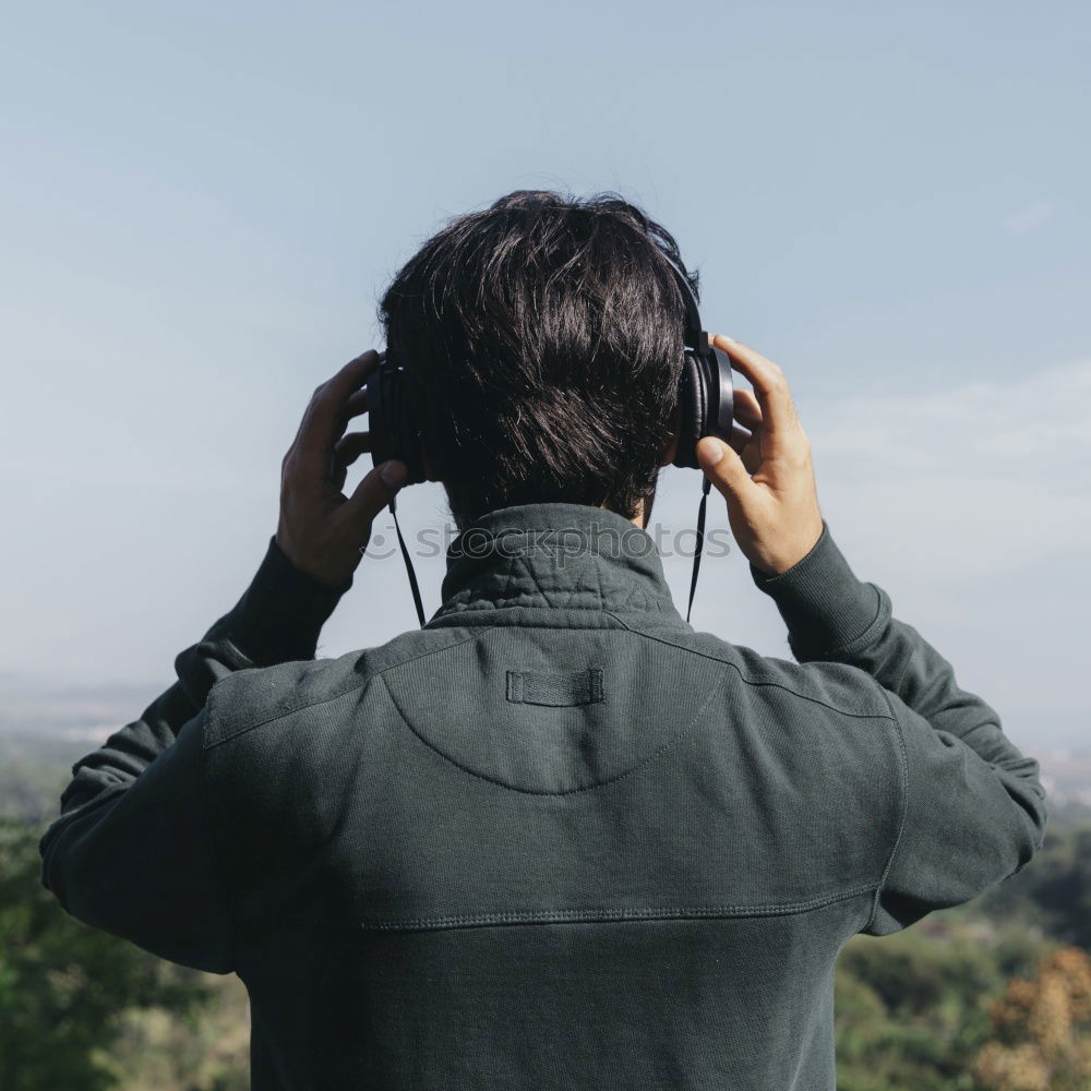 Similar – Man with camera walking in a rural road