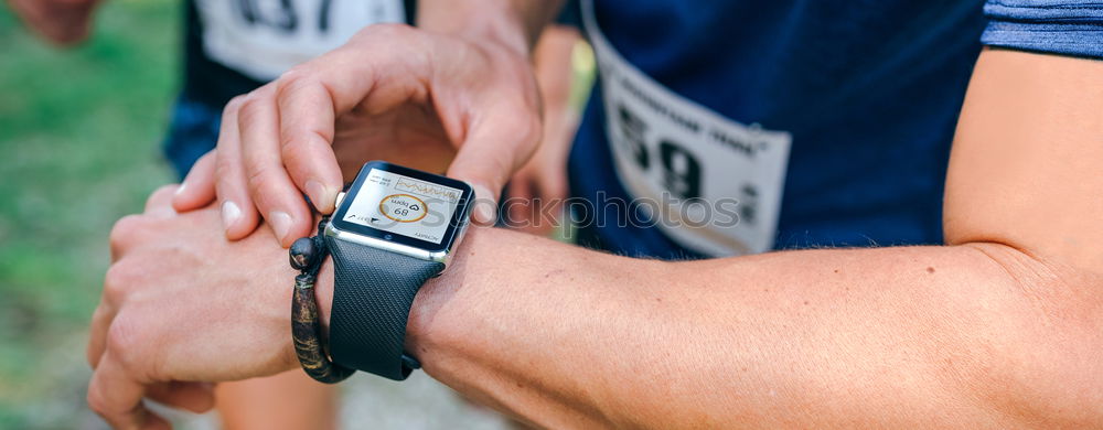 Similar – Sportsman looking a smartwatch