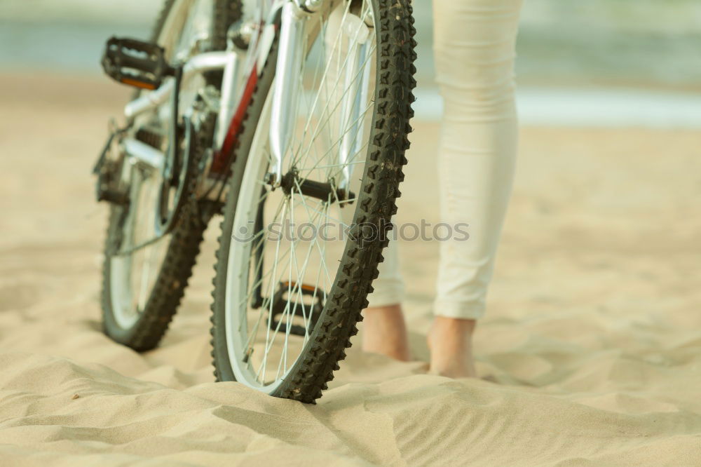 Similar – Image, Stock Photo Young sexy blonde girl is standing near the bicycle