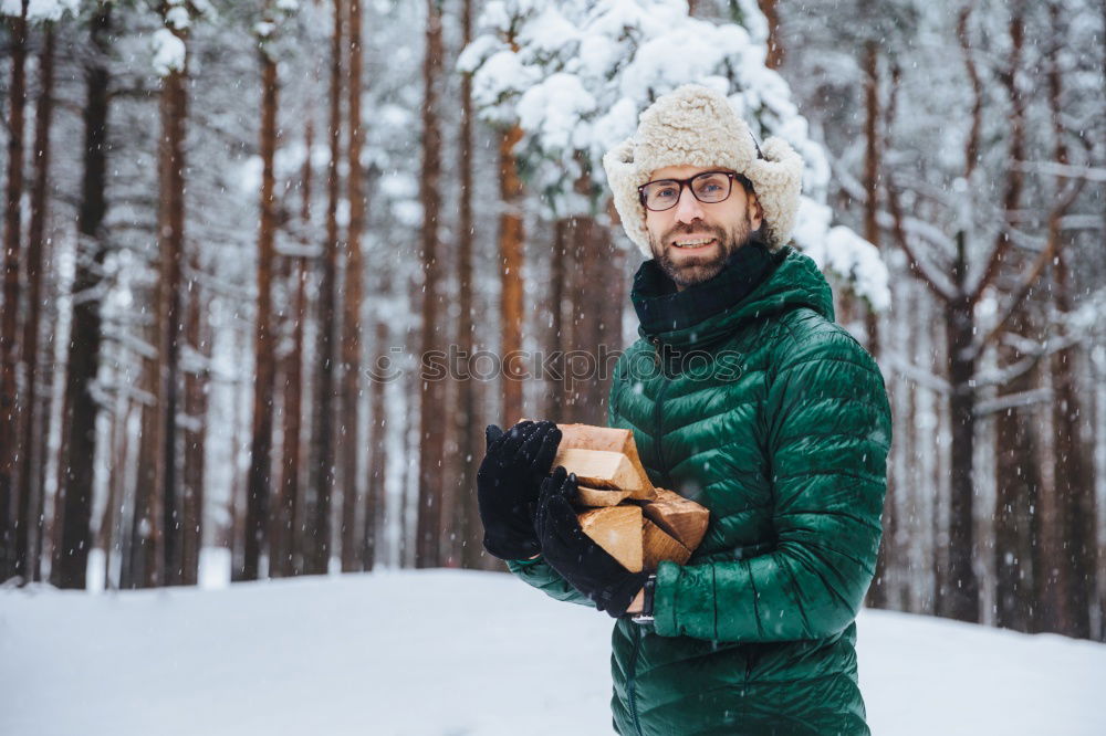 Similar – Image, Stock Photo Young and attractive man enjoying a snowy winter day