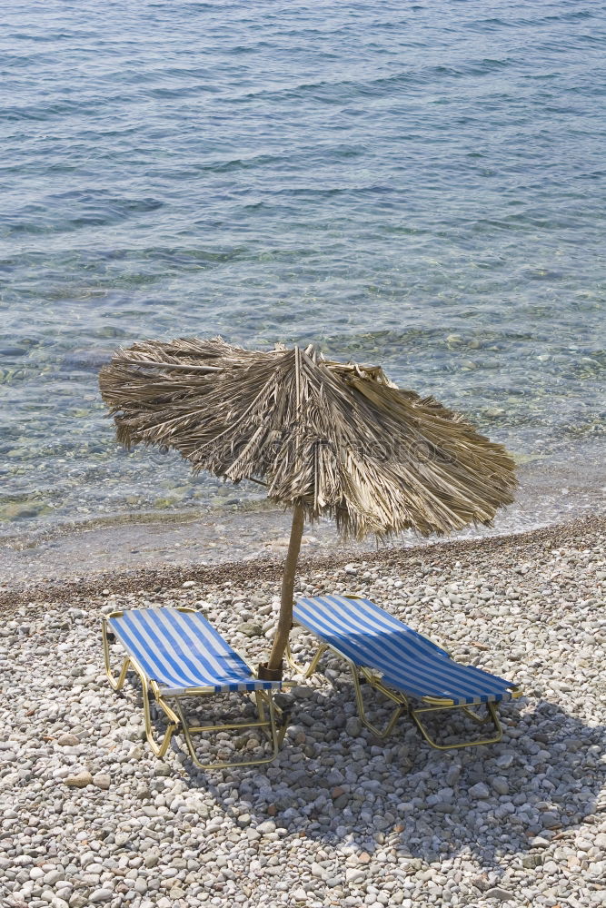 Similar – Straw umbrellas on the beach