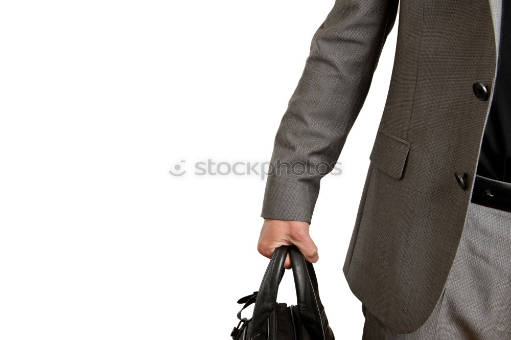 Similar – one person holds a leather travel bag in his hand