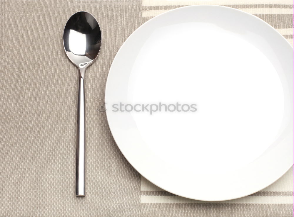 White dish with iron cutlery