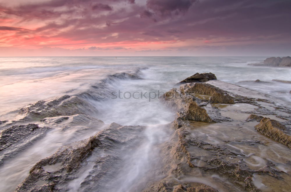 Similar – Rocks with spray in the sunset in Portugal II