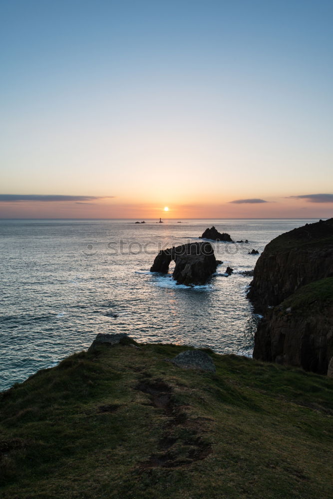 Similar – Image, Stock Photo Woman standing on the coast by the sea in England