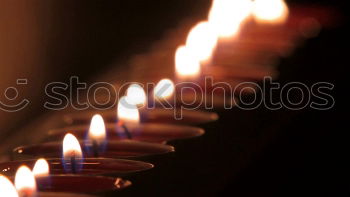 Similar – Lit beeswax candles in sand; Orthodox church