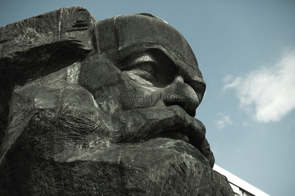 Similar – Image, Stock Photo male senior with silver-grey curls, glasses and three-day beard sitting in front of the Karl Marx monument in Chemitz