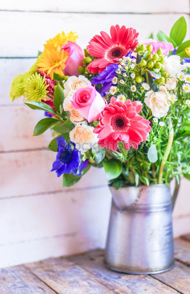 Similar – Image, Stock Photo Watering can with colorful garden flowers on the table