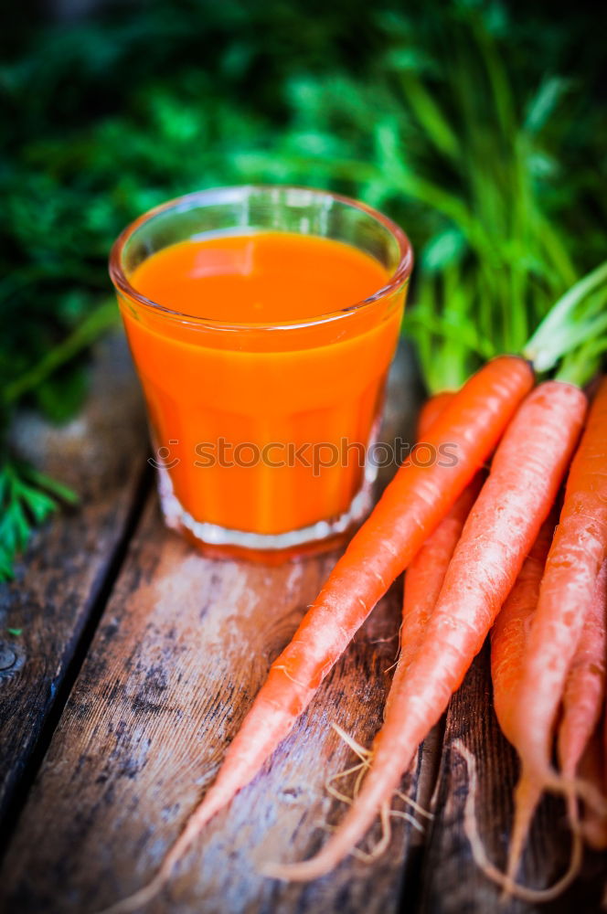 Similar – Juice in a mug on a gray wooden surface