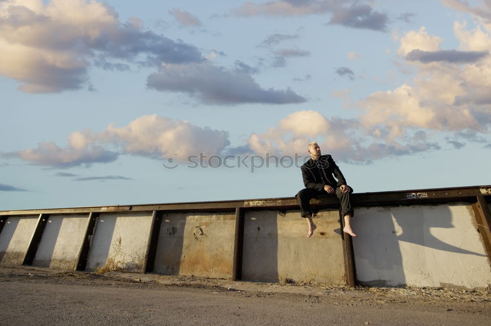 Similar – auf der mauer Mensch