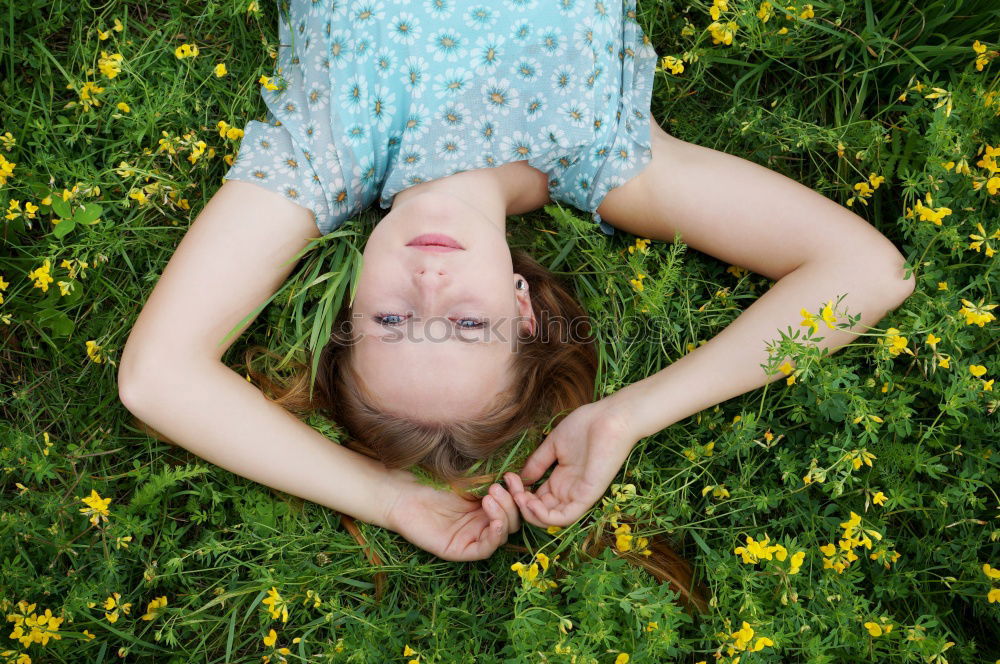 Similar – Excited girl in headphones on grass