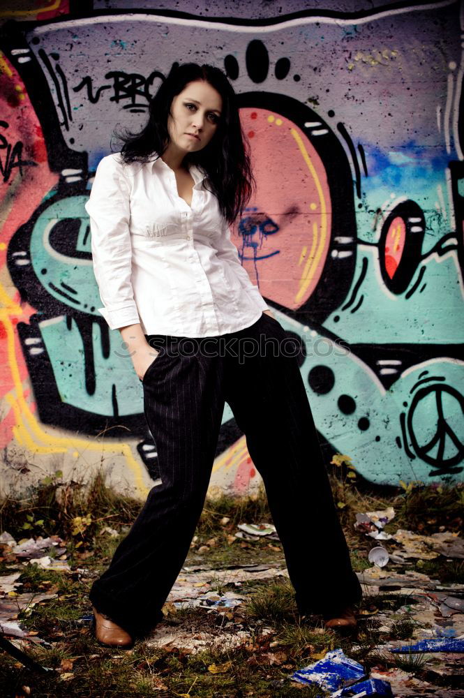 Similar – Image, Stock Photo Young short hair woman in urban environment and graffiti