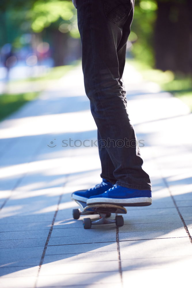 Similar – Person rides the skateboard