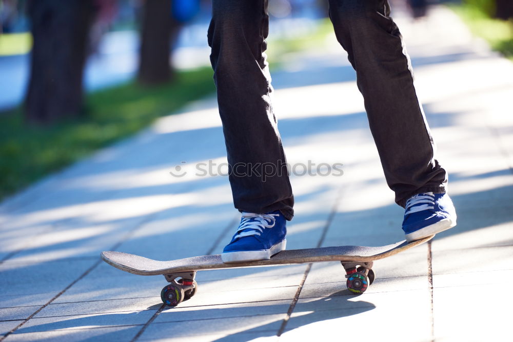 Similar – Person rides the skateboard