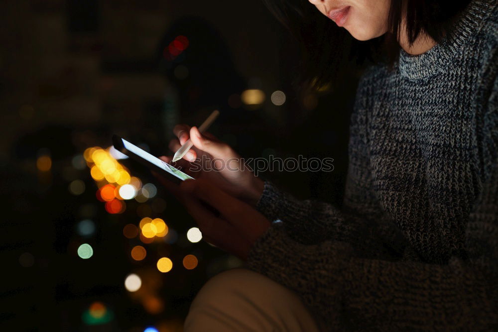 Image, Stock Photo Young people using tablet computer at home. They looking at pictures standing by the window in the evening. City lights outdoor