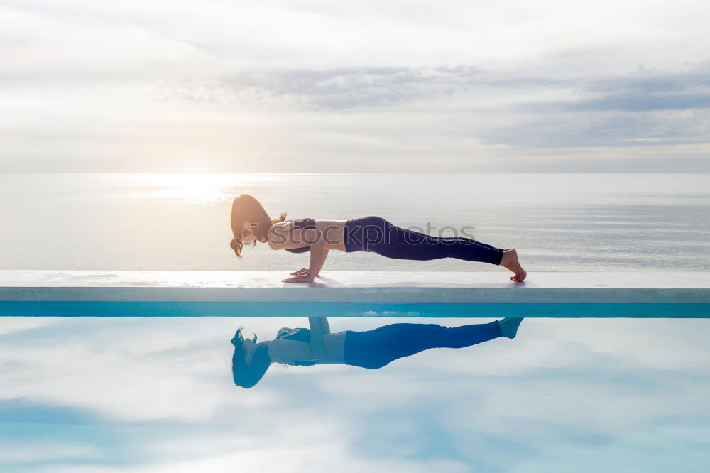 Similar – Athletic man balancing on gymnastic rings