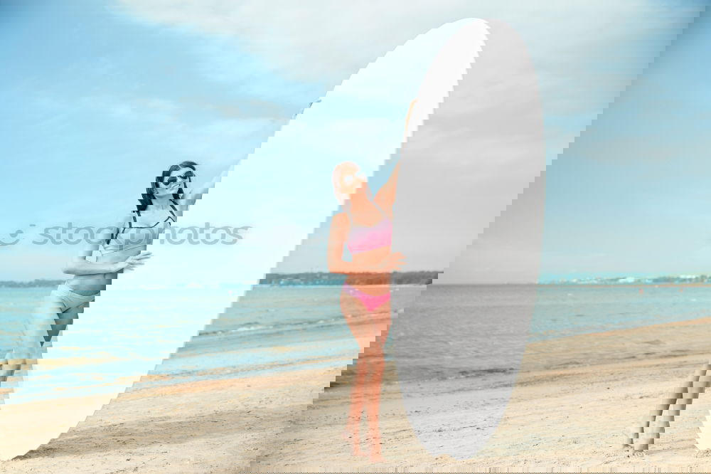 Similar – Image, Stock Photo Beautiful Surfer Girl standing on the Beach