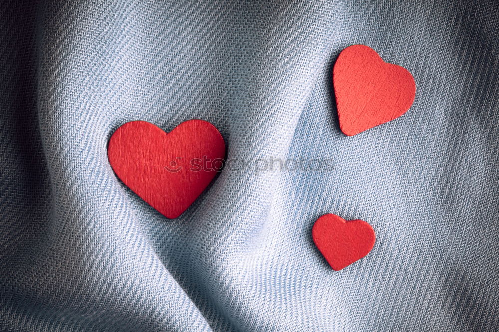 Similar – jeans and two red wooden hearts