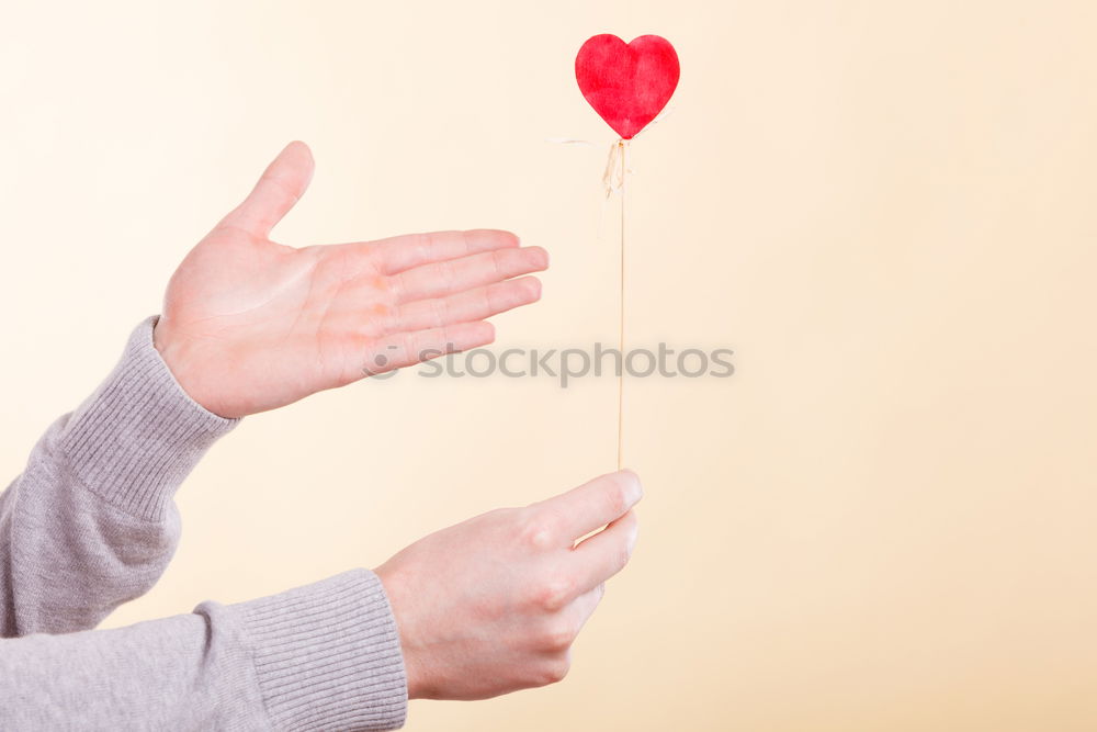 Similar – Woman’s foot with a red heart painted