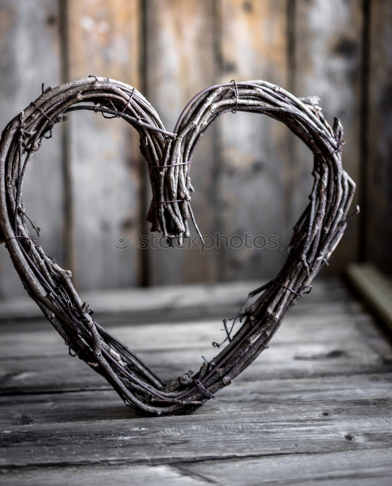 Similar – Stone heart shape on wood