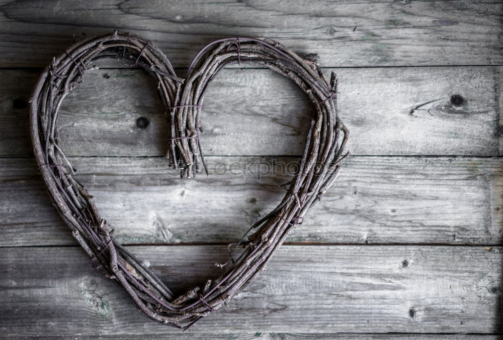 Similar – Stone heart shape on wood