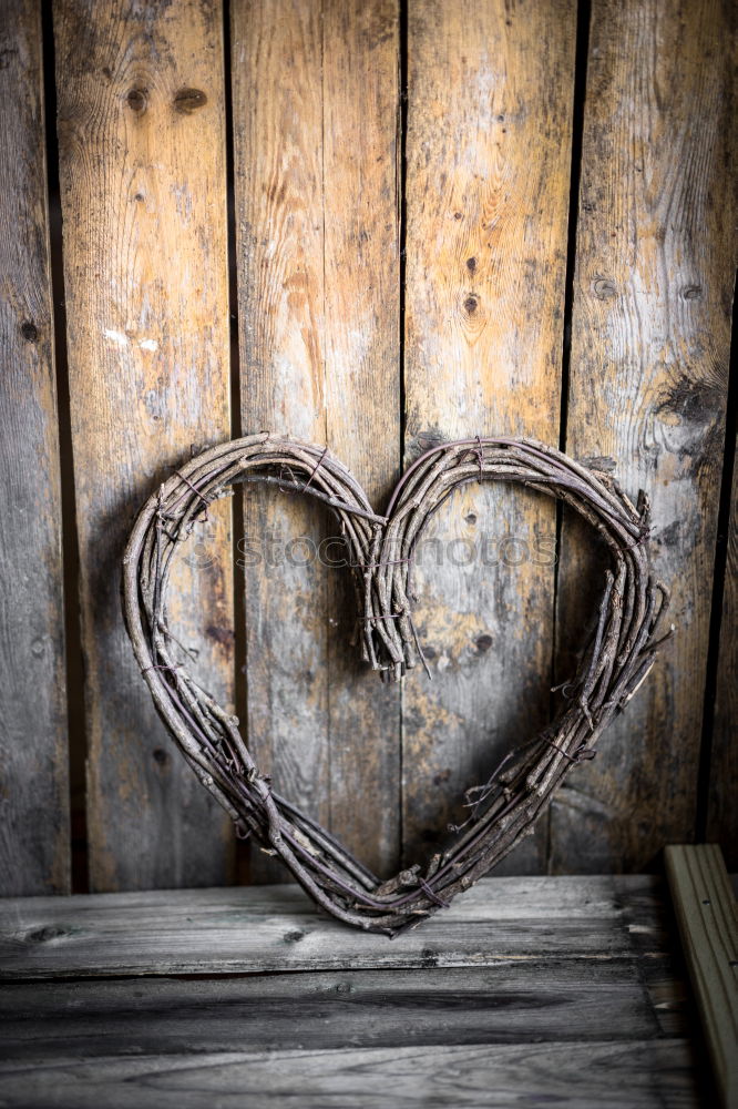 Stone heart shape on wood