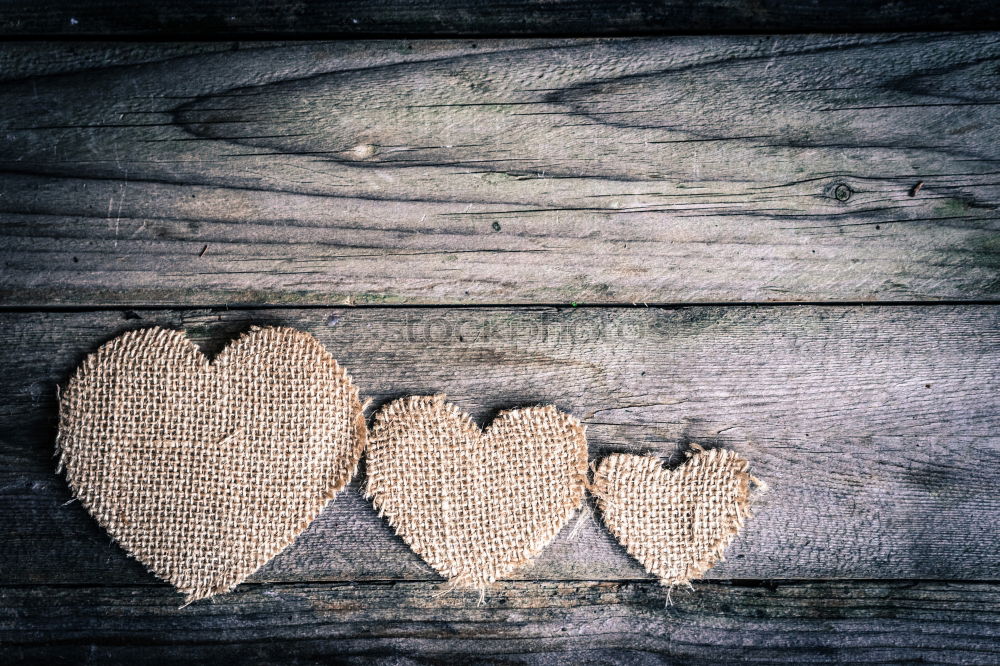 Vintage old rustic wooden hearts close up