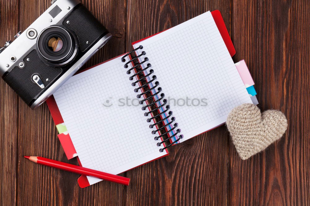 Similar – Camera, glasses and notepad on wood