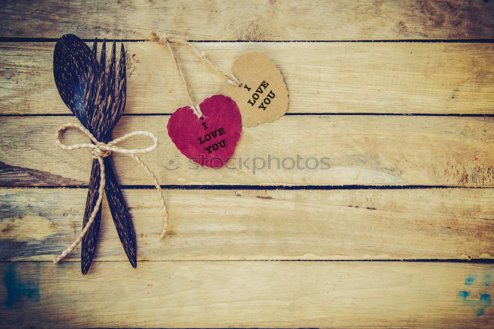 Similar – a paper picture with a rippled edge from the 1960s with a toddler in a pram lies on a wooden board next to leaves