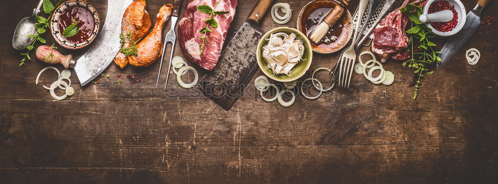 Home breakfast preparation with bagel bread, salmon, avocado , fresh cheese, hummus and cooked quail eggs on dark rustic wooden background, top view. Copy space for your design, banner