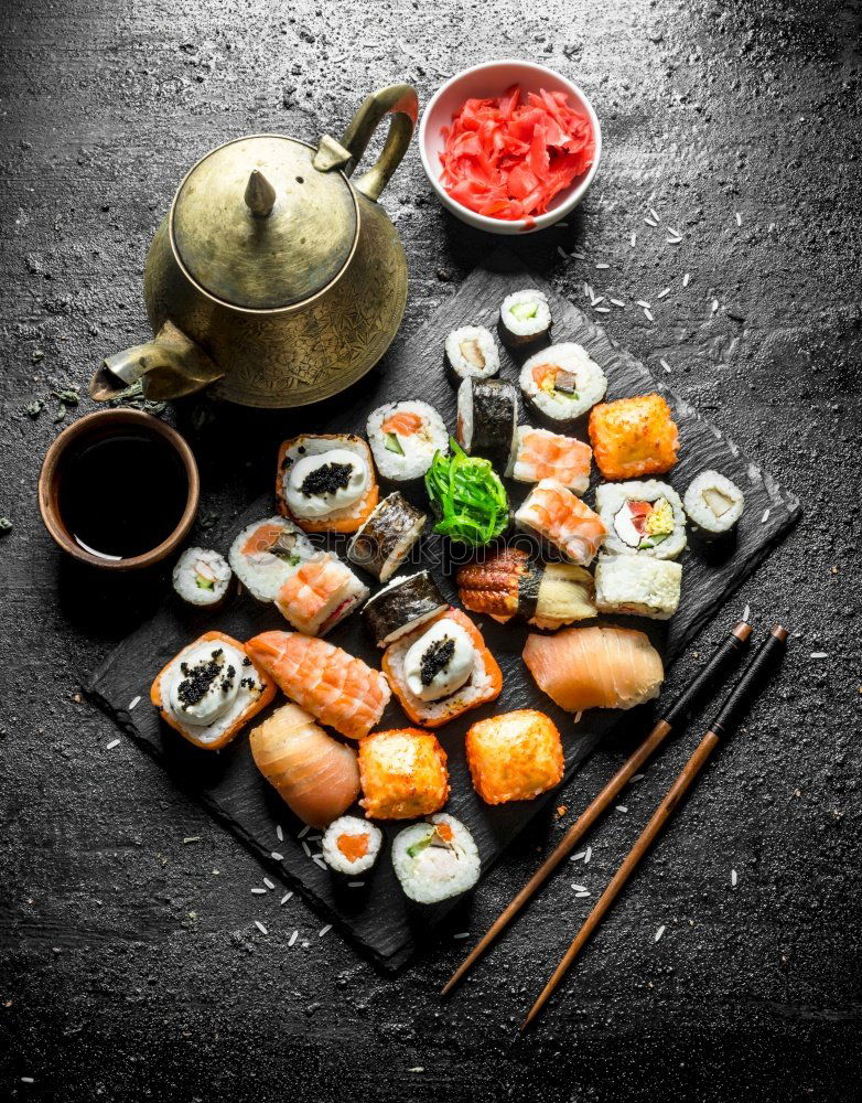 Similar – Image, Stock Photo Sushi set on pottery plate with chopsticks and soy sauce