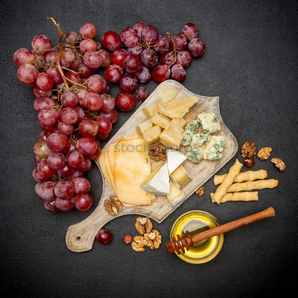 Similar – Image, Stock Photo Rustic cheese platter with various cheeses