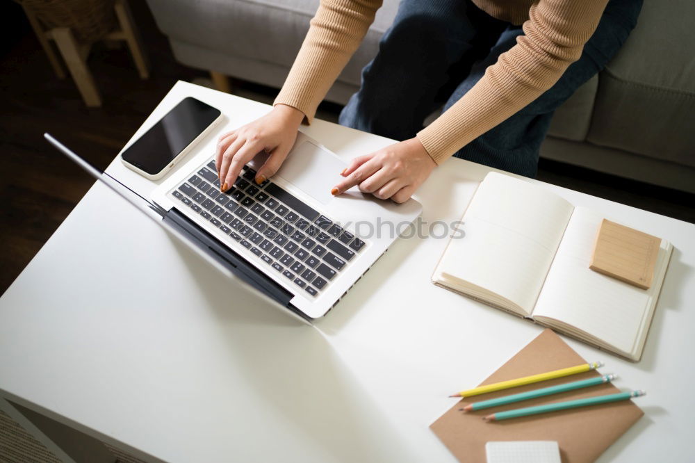 Similar – Young adult woman working on laptop in cafe