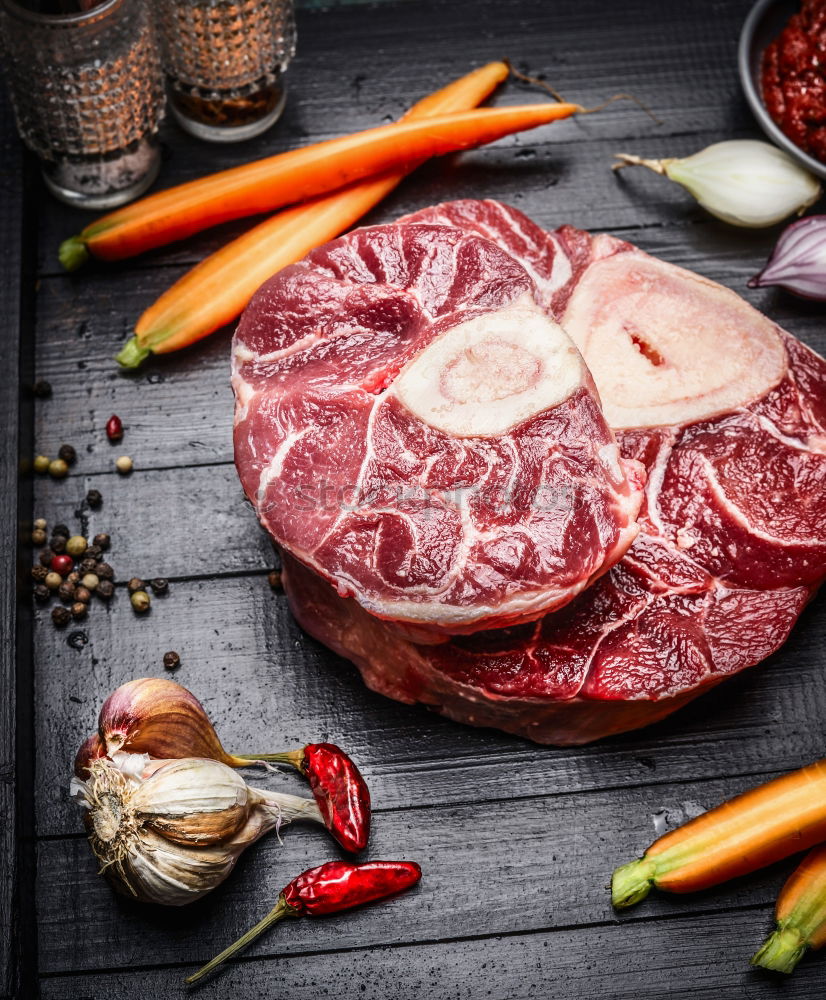 Knuckle of veal slices and ingredients for Osso Buco