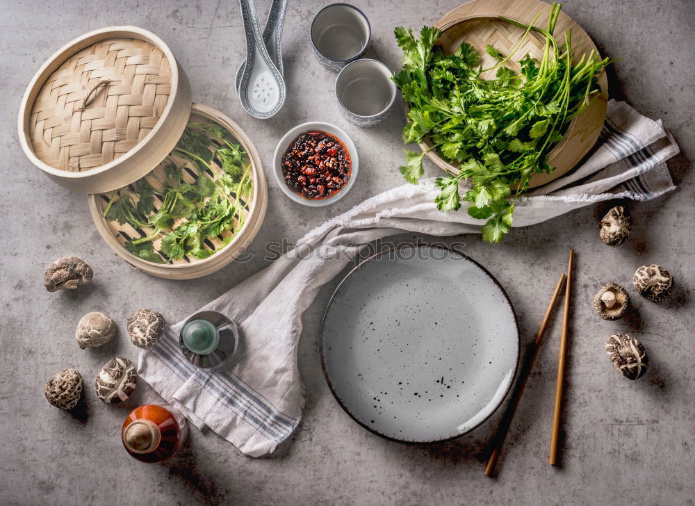 Image, Stock Photo Asian food concept with homemade dumplings on plates and in steamer, fine shiitake, traditional sauces and crockery. White kitchen cloth on grey concrete background. Top view