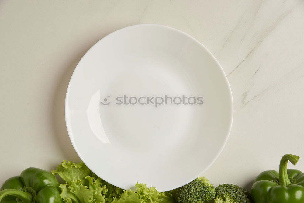 Similar – plate with a fork and knife on a brown wooden surface