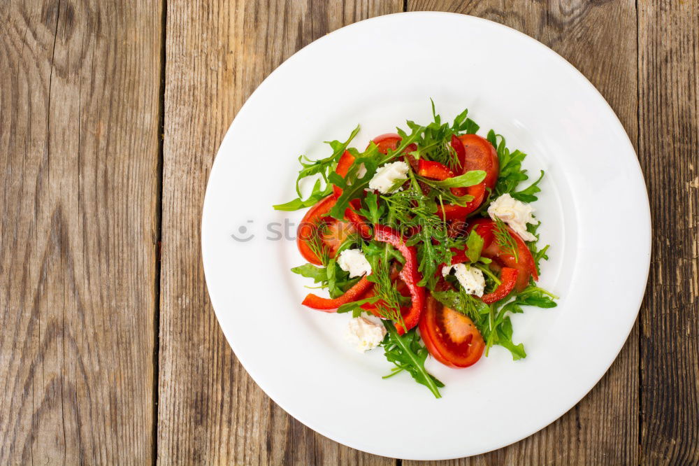 Similar – fresh salad on dark wooden table