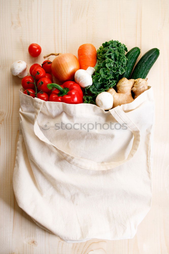 Similar – Image, Stock Photo Cloth bag with vegetables on wooden background.