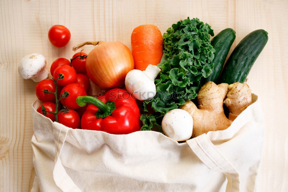 Similar – Image, Stock Photo Cloth bag with vegetables on wooden background.