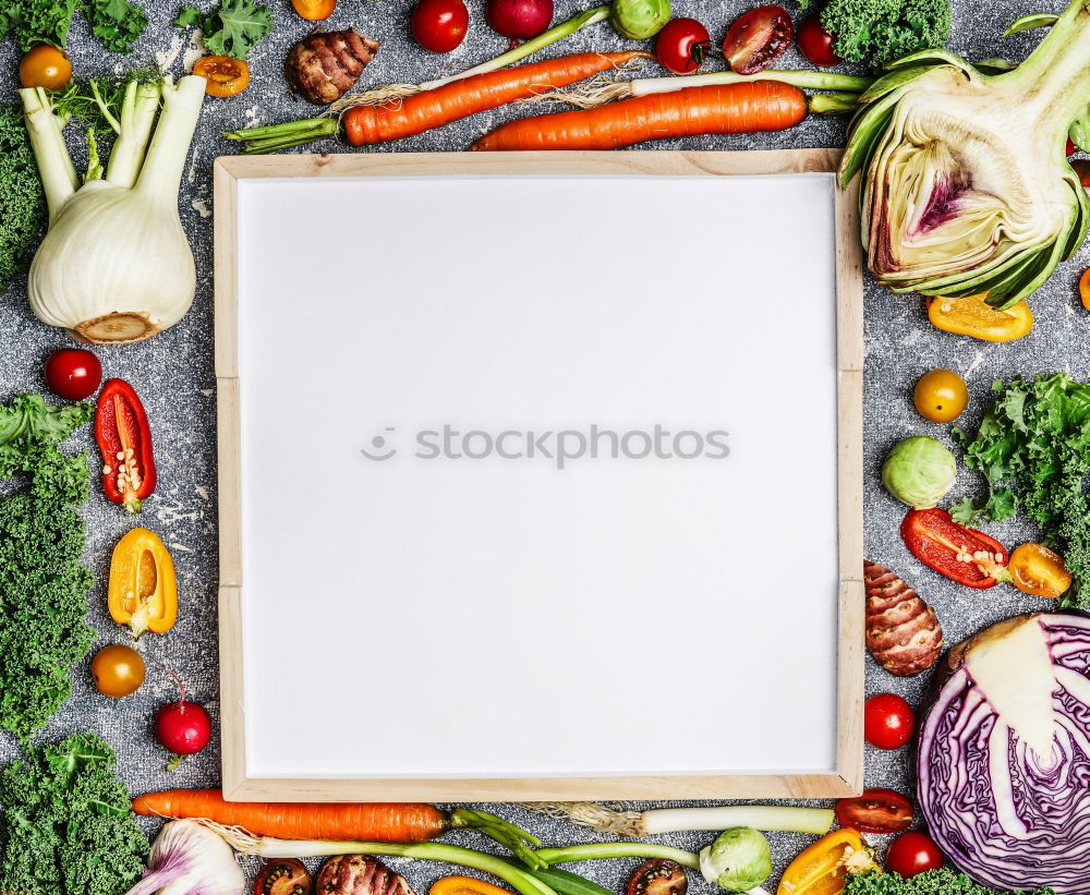 Fresh vegetables around a white table