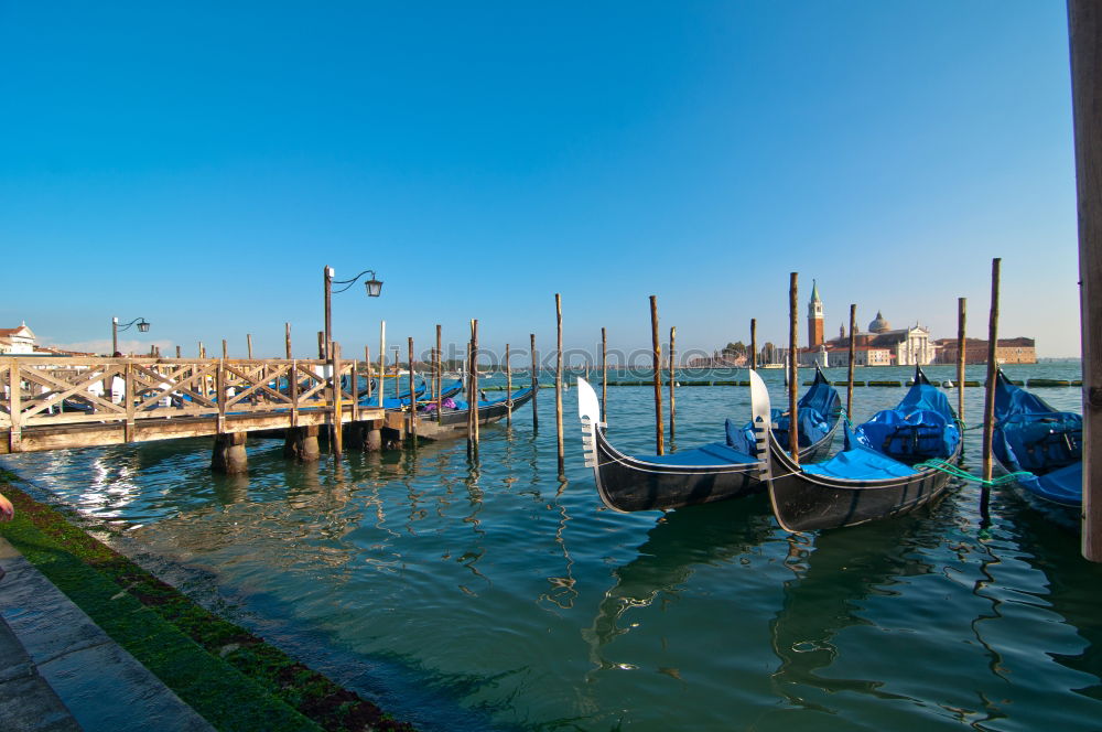 Similar – Image, Stock Photo Empty gondolas floating on a lagoon of Venice, Italy