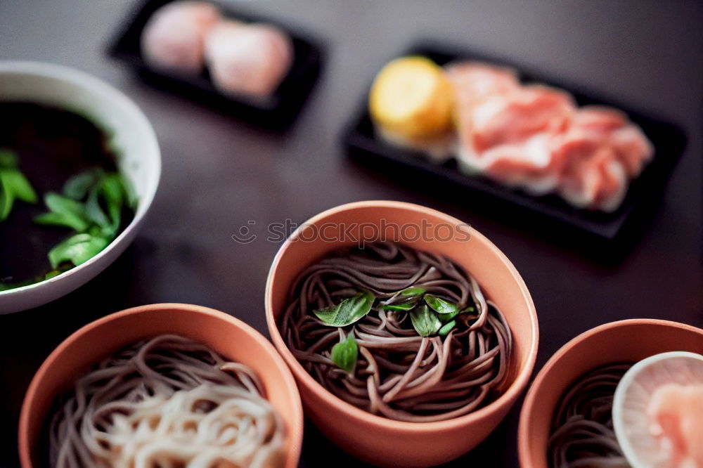 Similar – Foto Bild Eine Person sitzt mit Essstäbchen in der Hand vor einer leckeren Pho Suppe in Vietnam