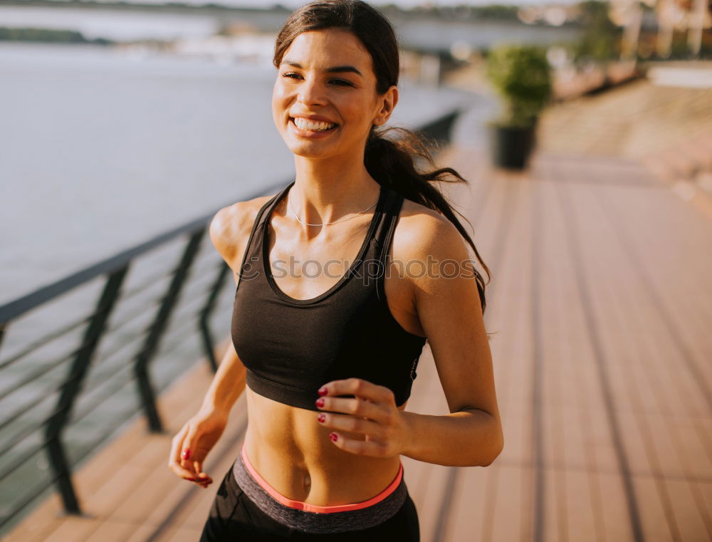 Similar – Woman jogging along a country road while listening to music