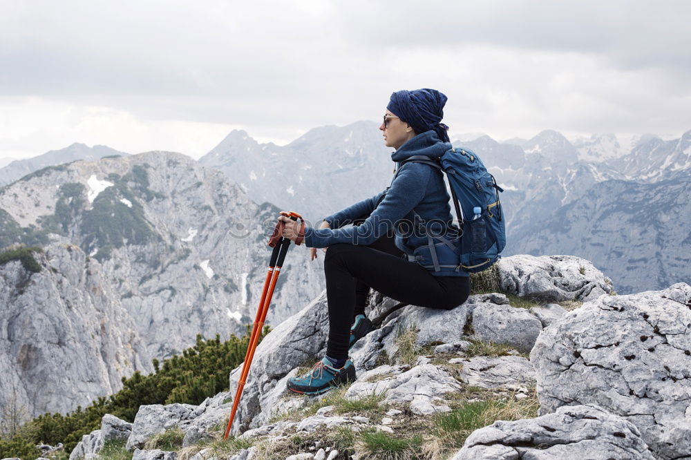 Similar – Image, Stock Photo Climbing sport: young boy takes a rest observing panorama