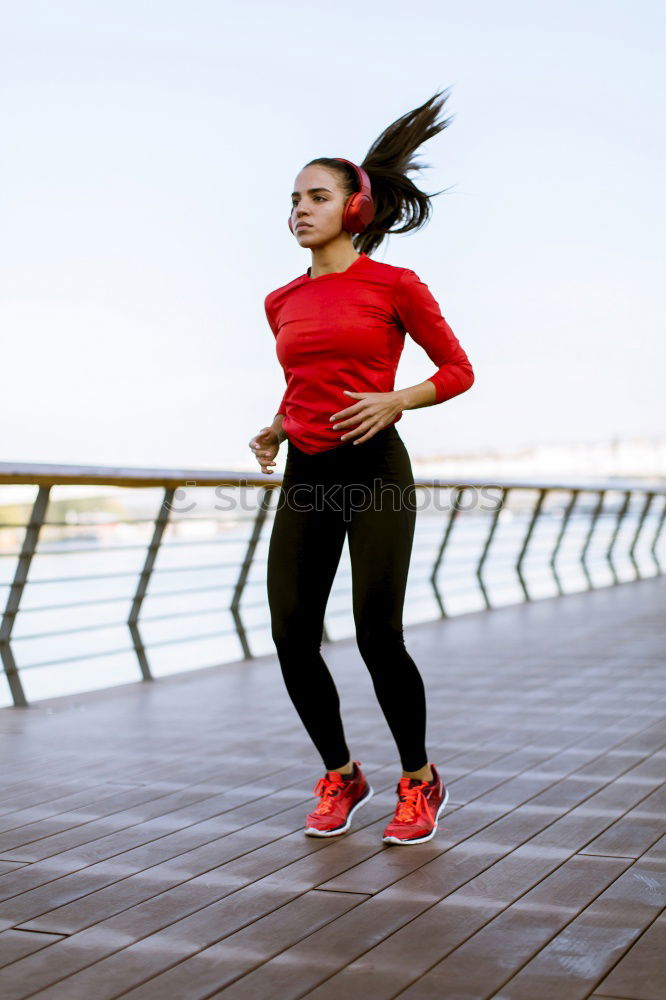 Similar – Young Woman working out outdoors and having fun