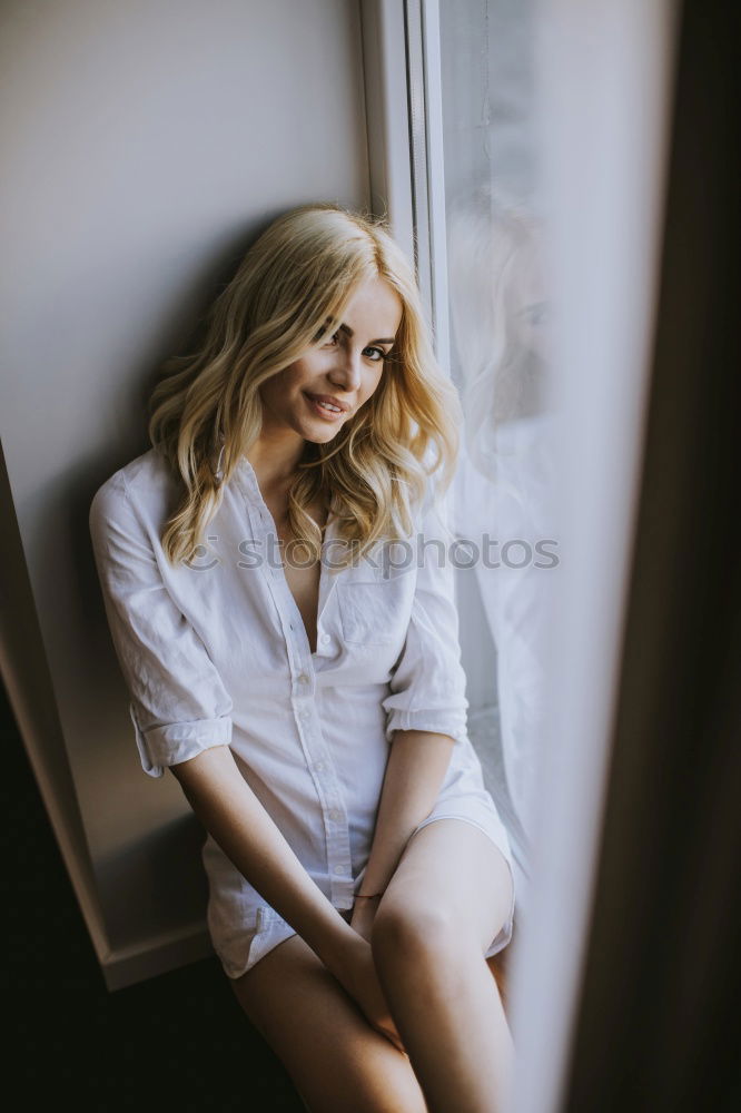 Similar – Image, Stock Photo Happy young blond woman sitting on urban autumn background.
