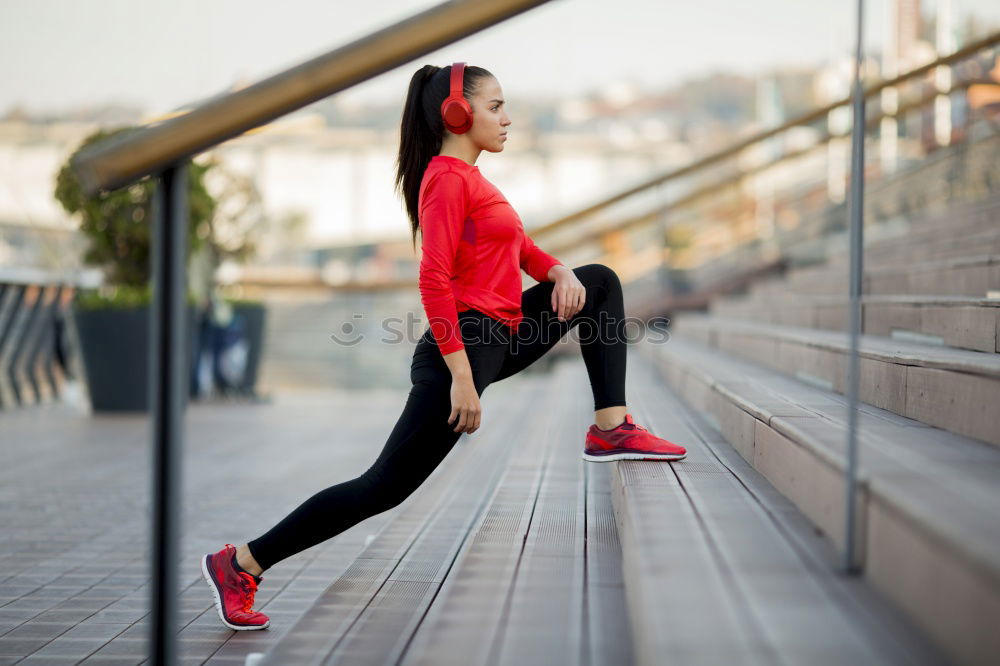 Similar – Young black woman doing stretching after running outdoors