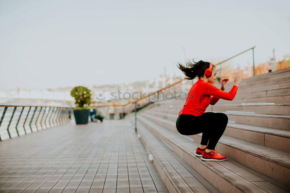 Similar – Young fitness woman runner running on city bridge.